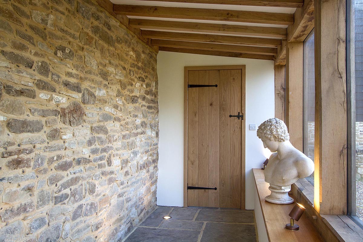 Decorative penny end T hinges on a traditional timber door in a heritage building