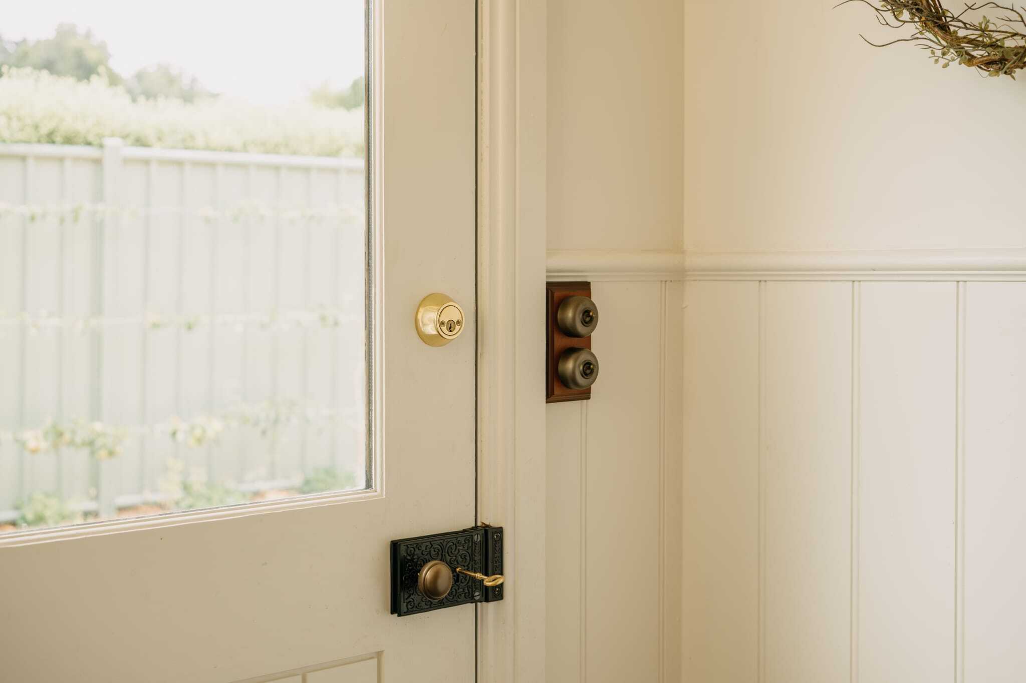 Mortice Knob and Rim Lock on External Door Insitu image of a mortice knob and rim lock on heritage door